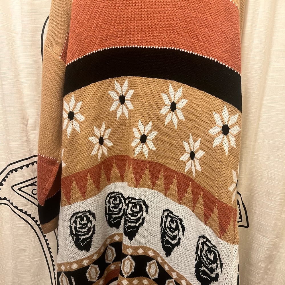 Gorgeous long cardigan sweater. Perfect for cozy autumn outings